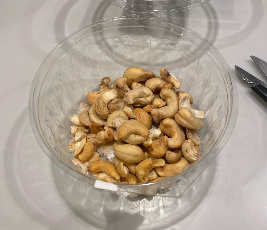 Cashews in plastic bowl.